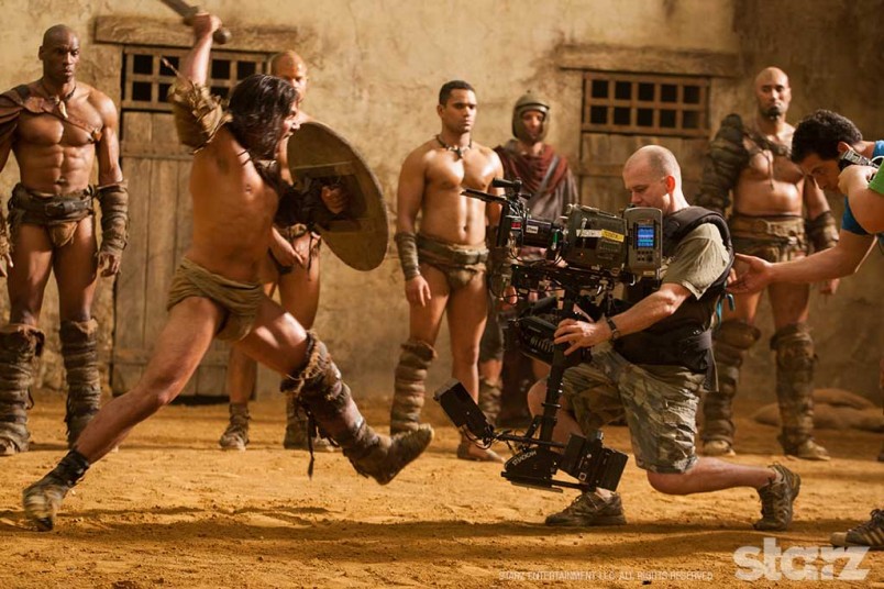 Manu Bennett lunges at Steadicam operator Cameron McLean